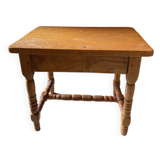 Small footrest bench in bohemian style.