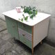 Almond/pink bedside