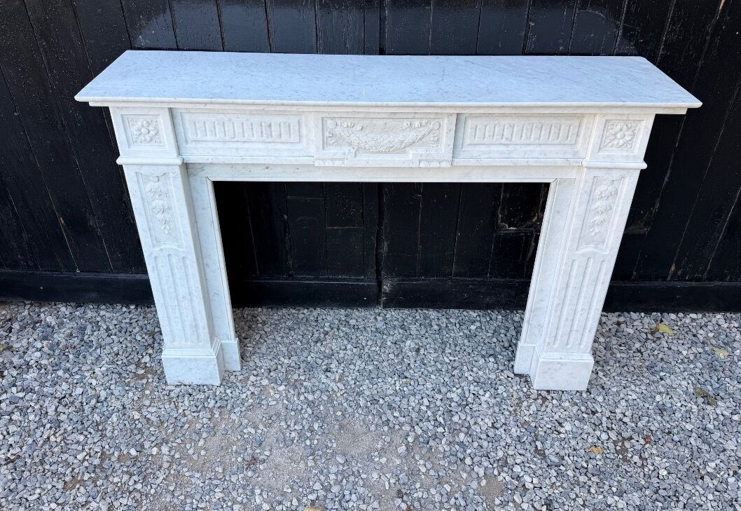 Louis XVI style fireplace in white Carrara marble, circa 1880.