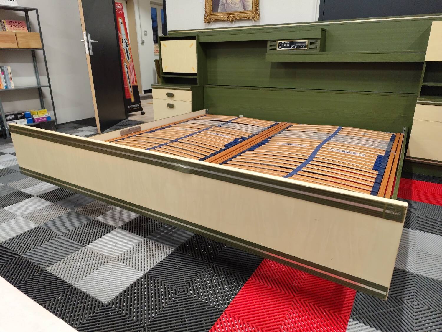 Vintage king-size bed with headboard furniture and built-in radio.