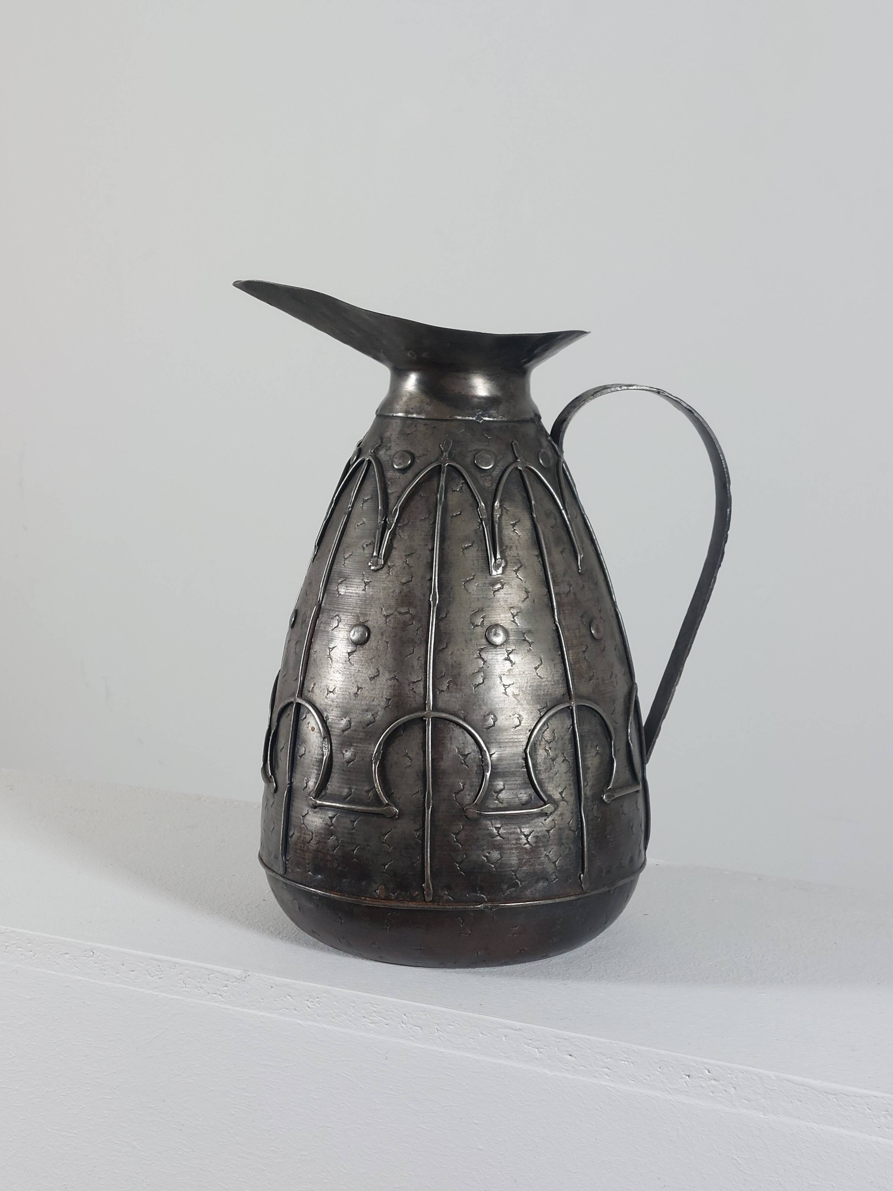 Rare hand-forged metal pitcher and craftsmanship from France.