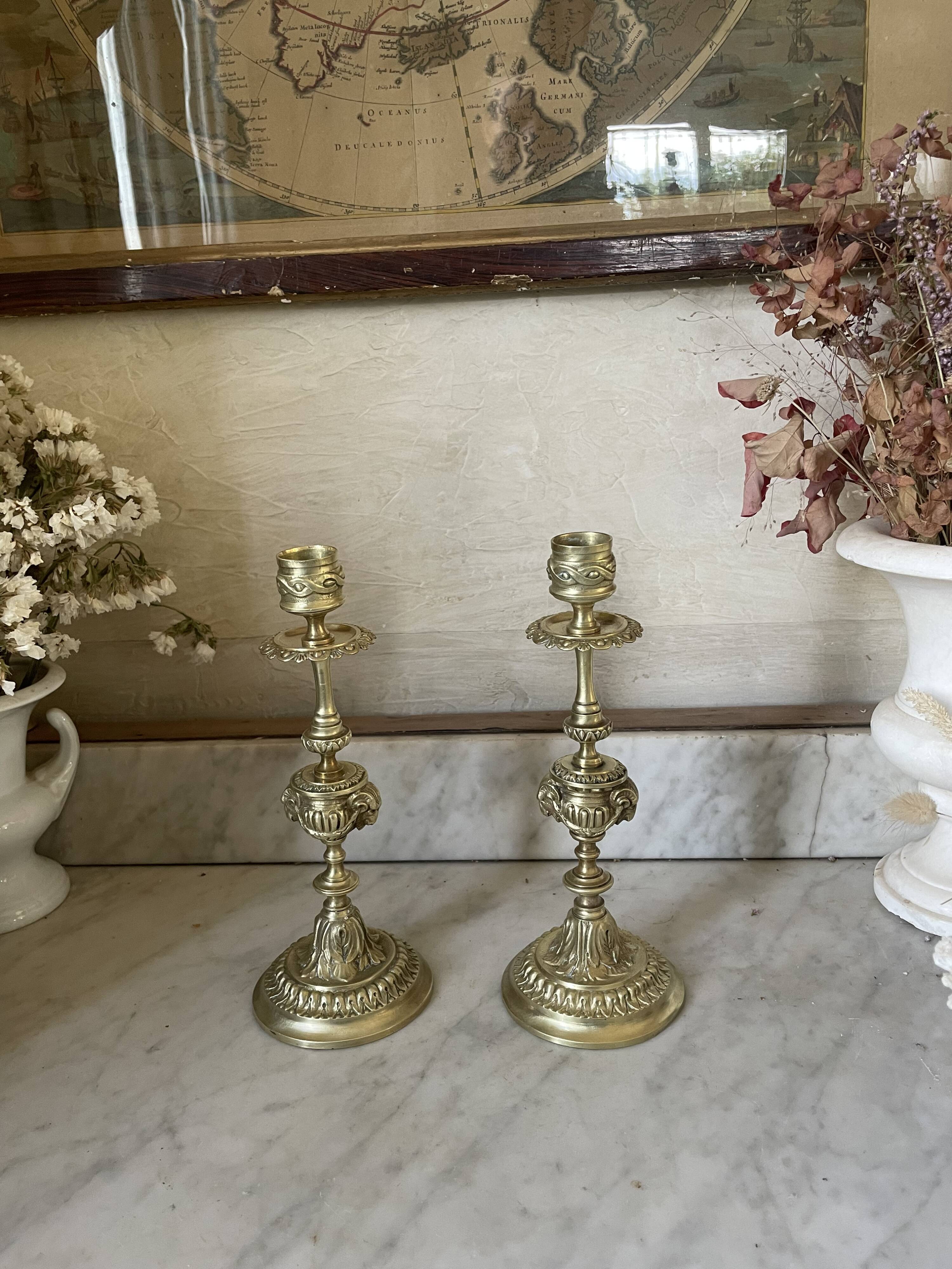 Pair of gilt bronze ram's head candlesticks, Louis XVI style, 19th century.