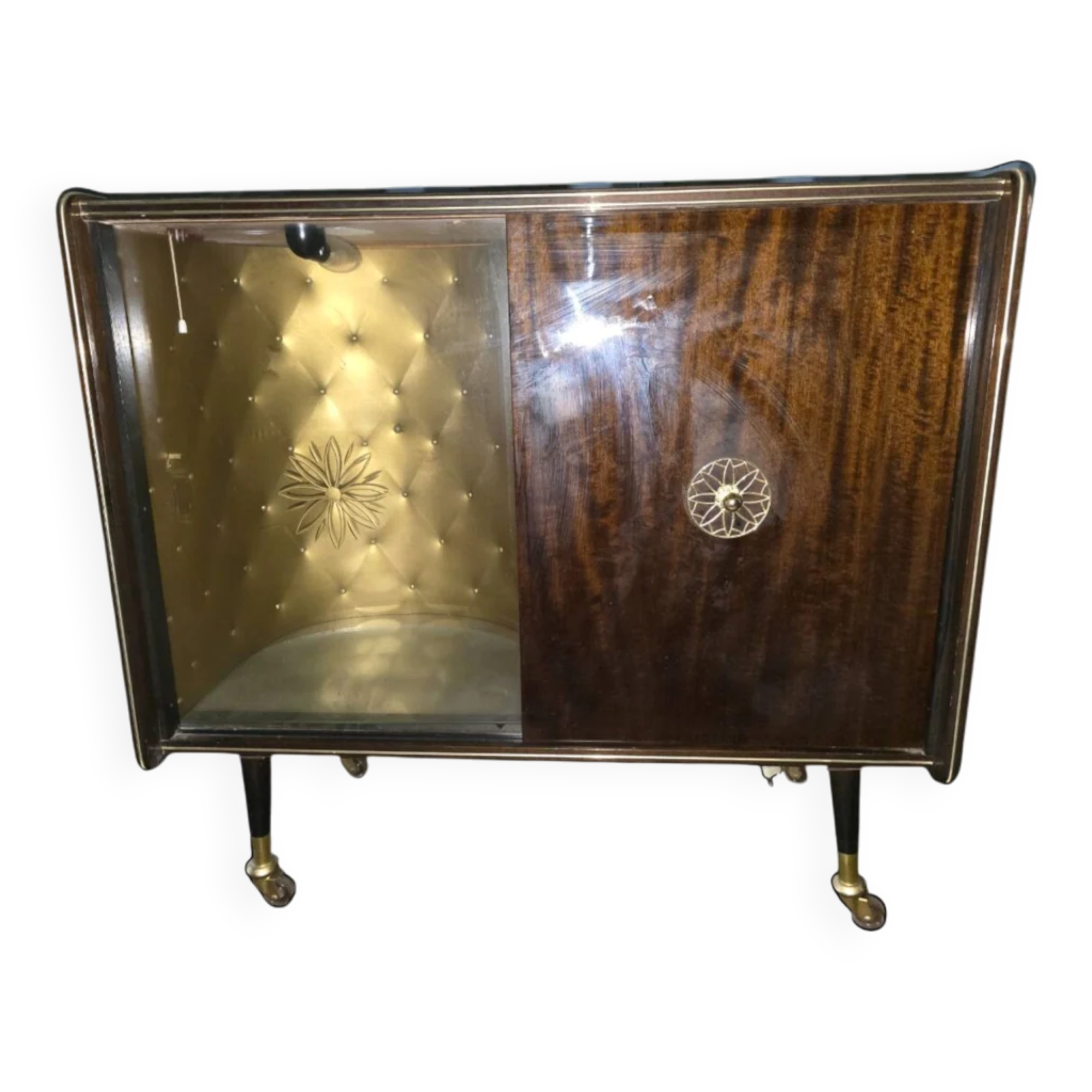 Vintage 50s-60s bar cabinet with tufted upholstery and lighting.