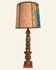 Renaissance table lamp in polychrome carved wood with cherubs.