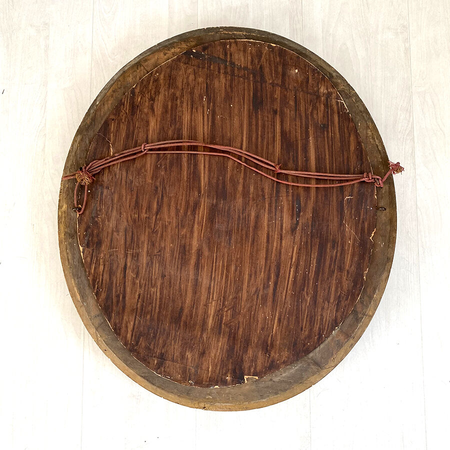 Miroir ovale en bois et stuc doré