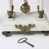 Clock and pair of Louis XVI style candelabras.