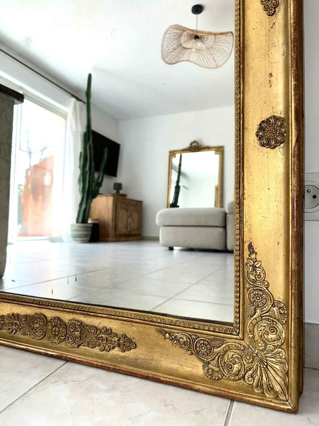 Antique gilded mirror from the Restoration period, 19th century.