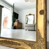 Antique gilded mirror from the Restoration period, 19th century.