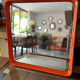 Orange moulded plastic mirror