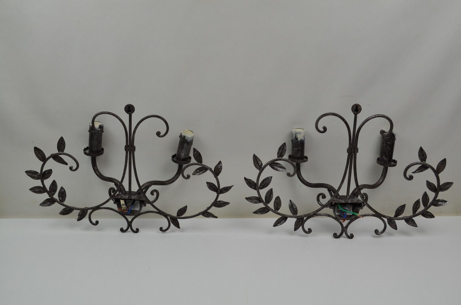 pair of grey patinated iron wall sconces