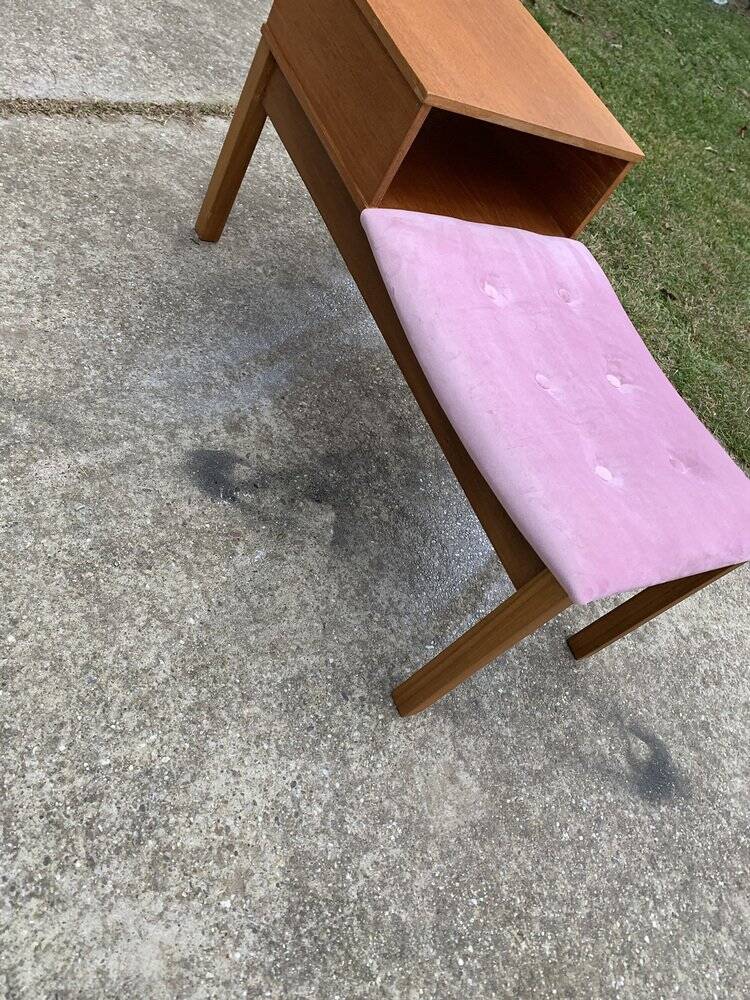 Mid-Century telephone bench in teak with bright pink fabric seat and wooden top.