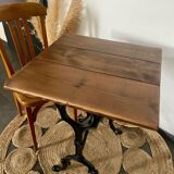 Bistro table with iron legs and raw wood top
