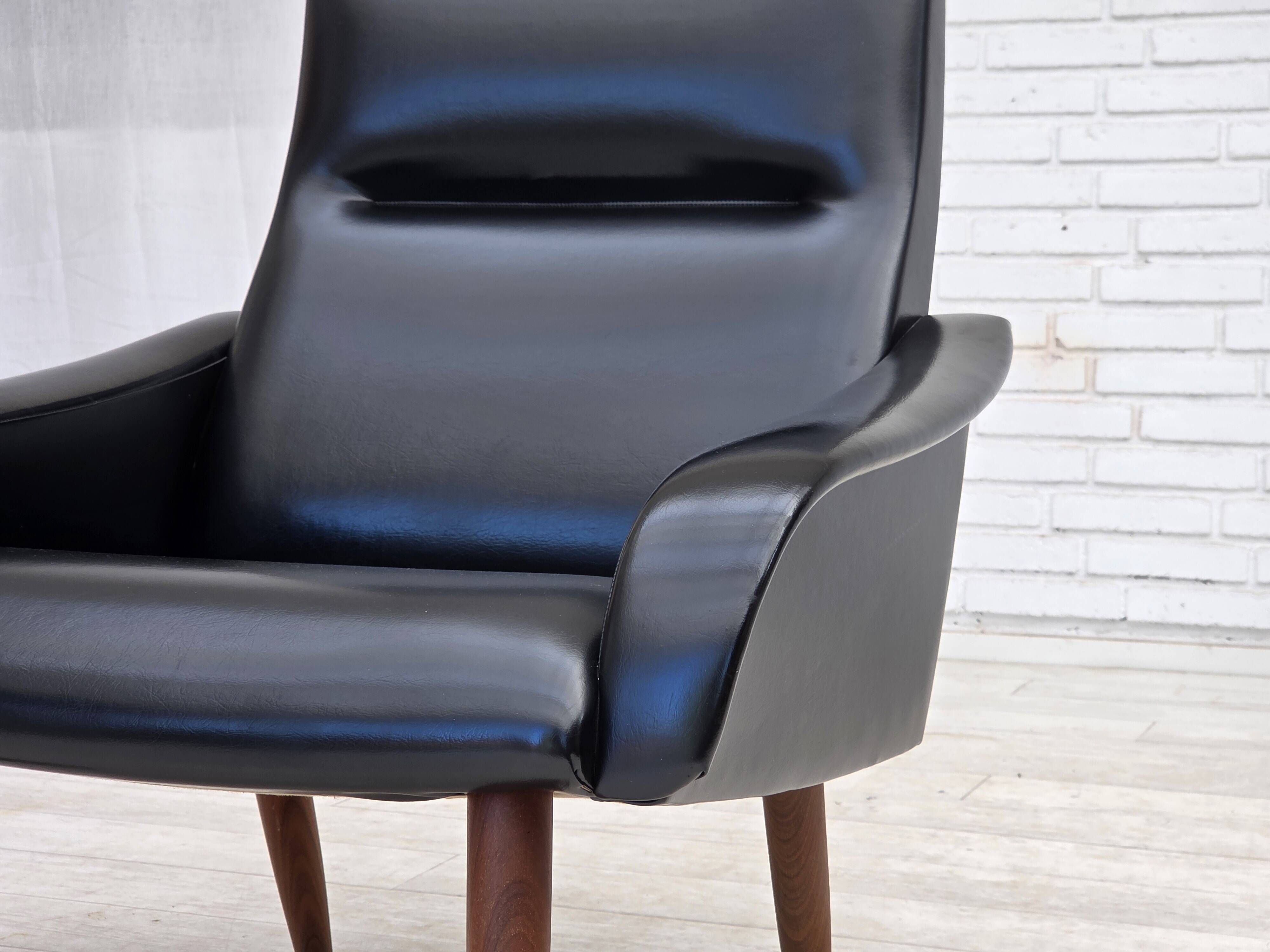 1970s, Danish armchair, black artificial leather, teak wood legs.
