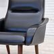 1970s, Danish armchair, black artificial leather, teak wood legs.