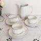 Set of 3 white and gold bistro coffee cups and coffee pot, in porcelain