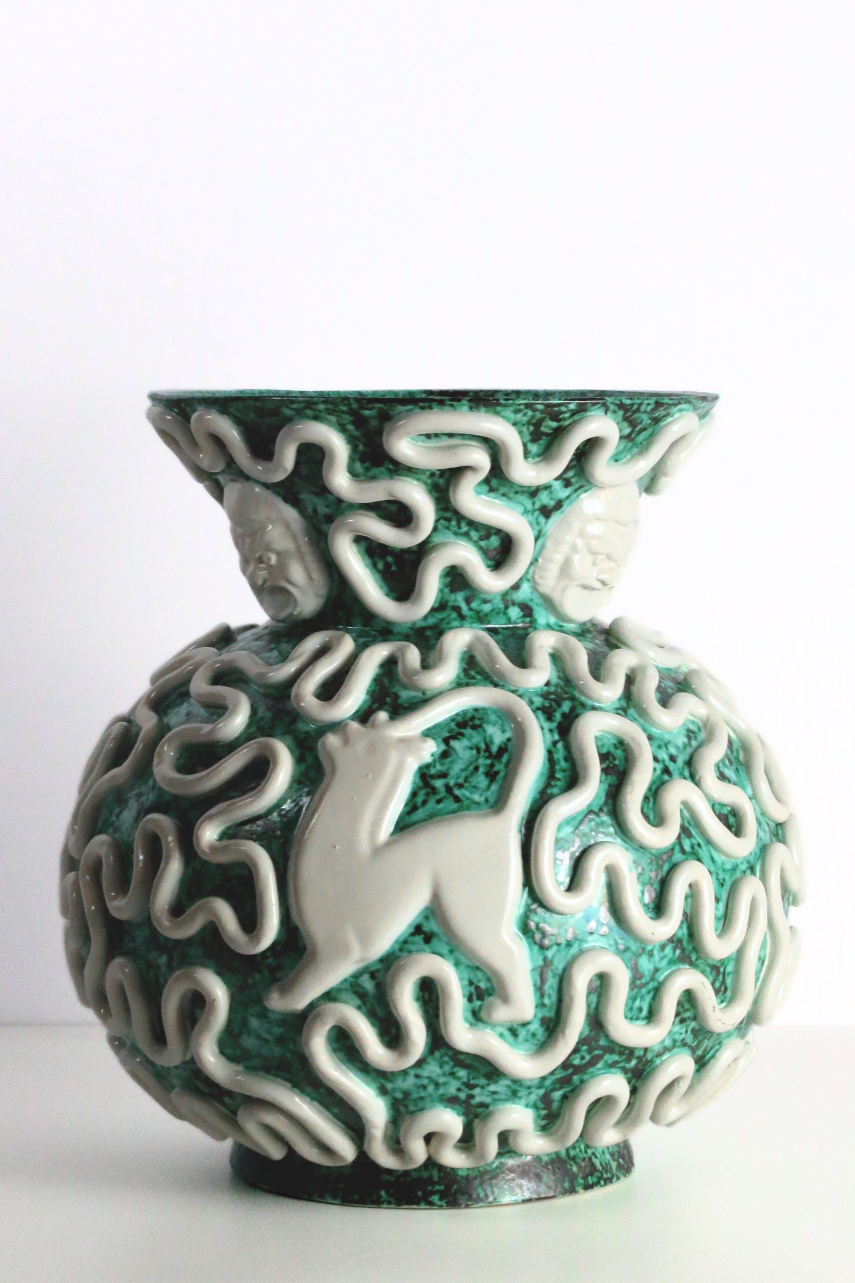 Manufacture Sainte-Radegonde, vase pansu aux mascarons en céramique émaillée