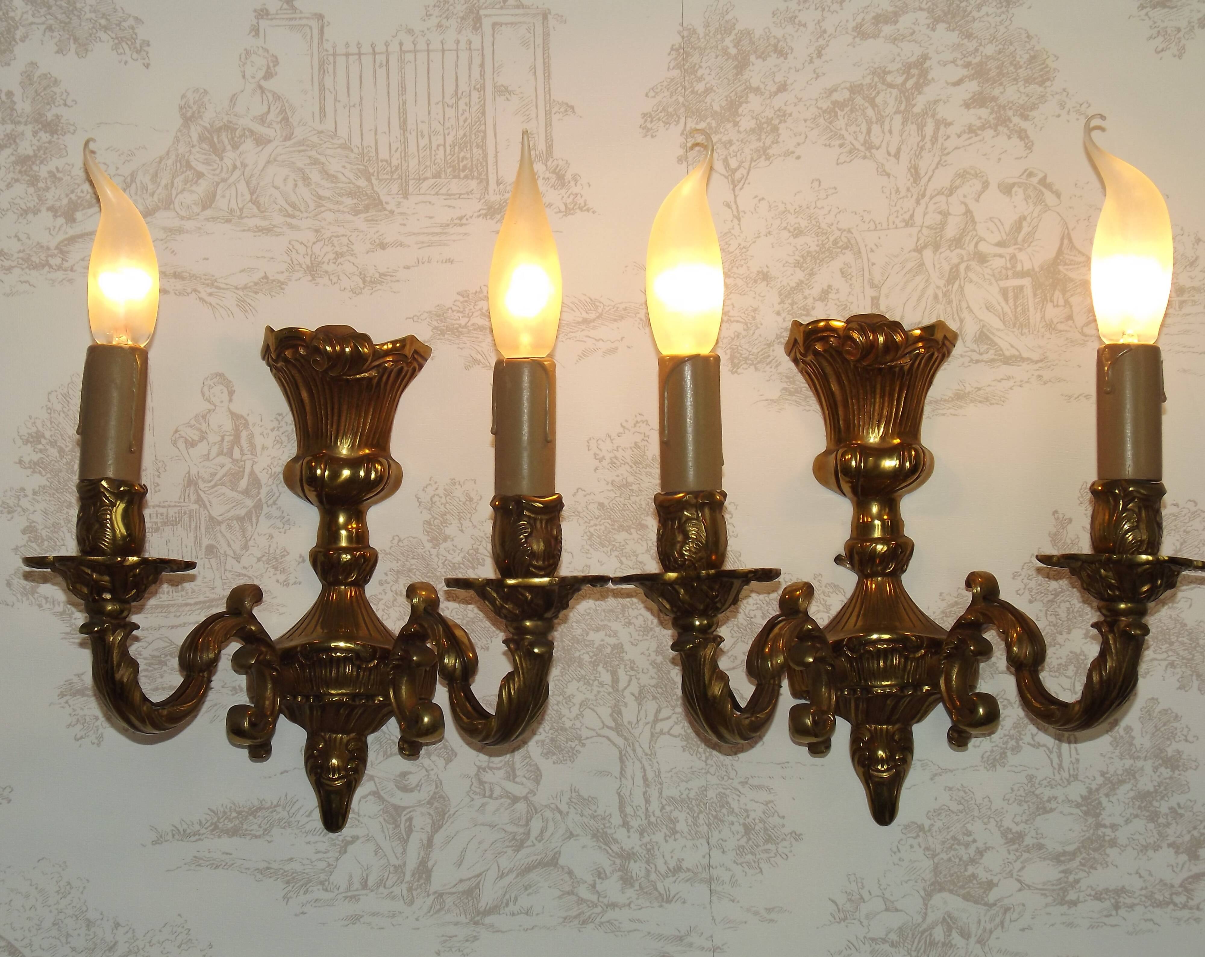Pair of French baroque brass wall sconces with two branches, decorated with acanthus and wickerwork.