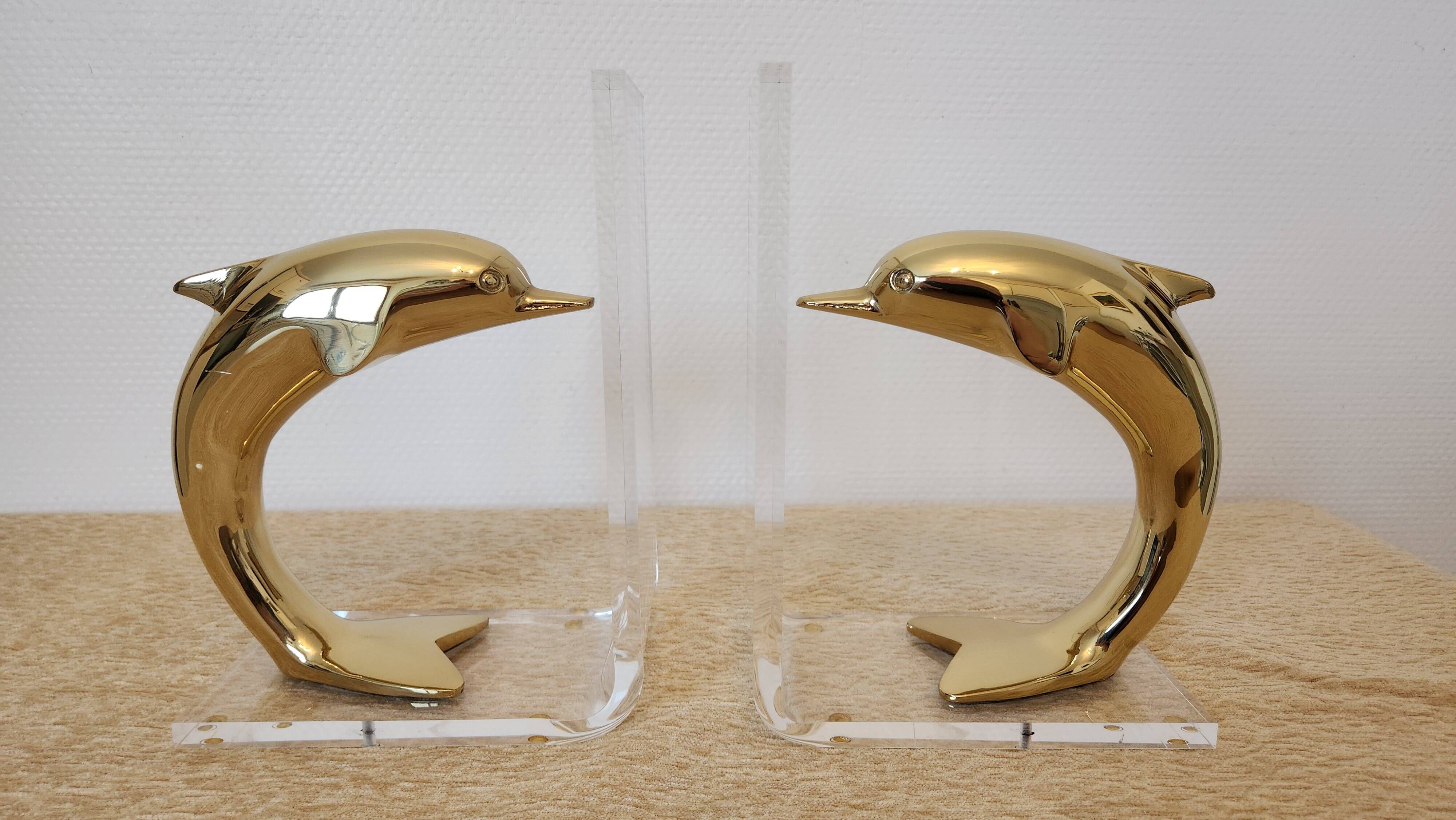 Dolphin bookends in gold metal and plexiglass – 1980s