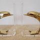 Dolphin bookends in gold metal and plexiglass – 1980s