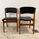 Chaise vintage scandinave en bois et simili cuir noir