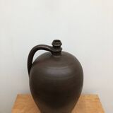 Ancient varnished sandstone jug