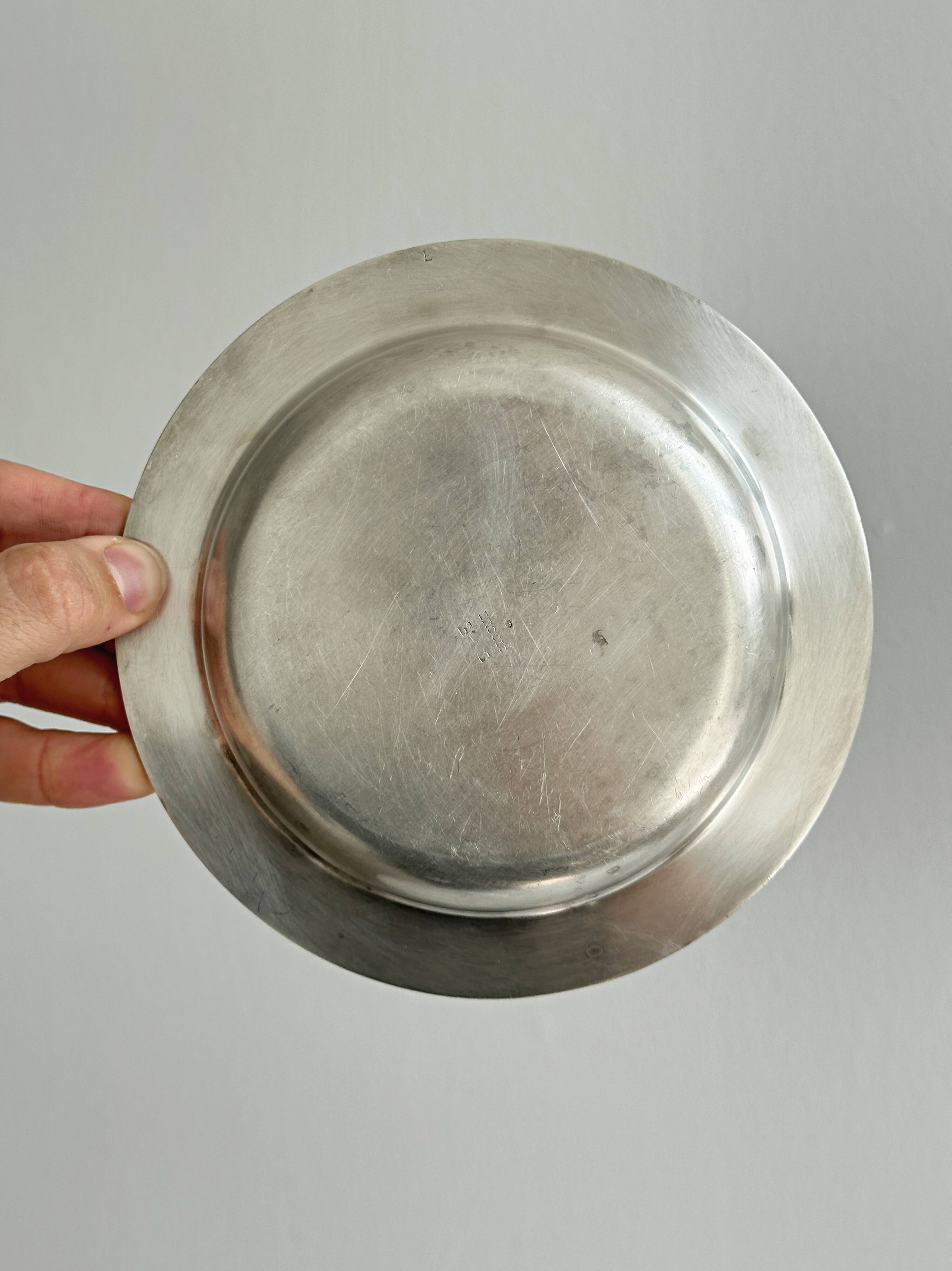 Round patinated silver-plated metal dish
