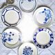 Mismatched antique flat plates in earthenware