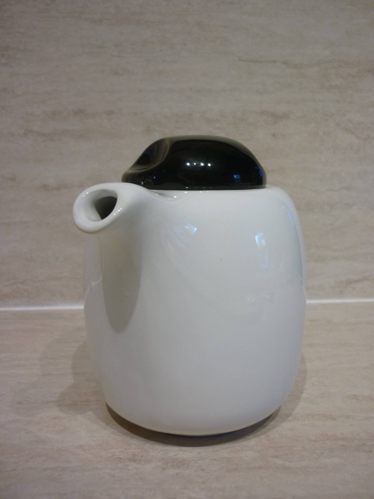 Black and white ceramic coffee maker