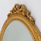 Oval shaped carved gilded Baroque mirror with beveled glass, Belgium