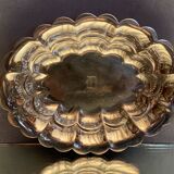 Oval-shaped polylobed metal cup with silver patina engraved with the letter D