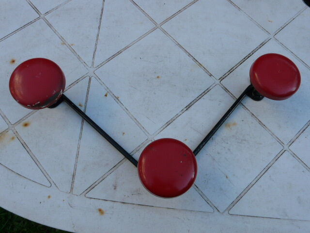 Vintage black and red metal wall coat rack
