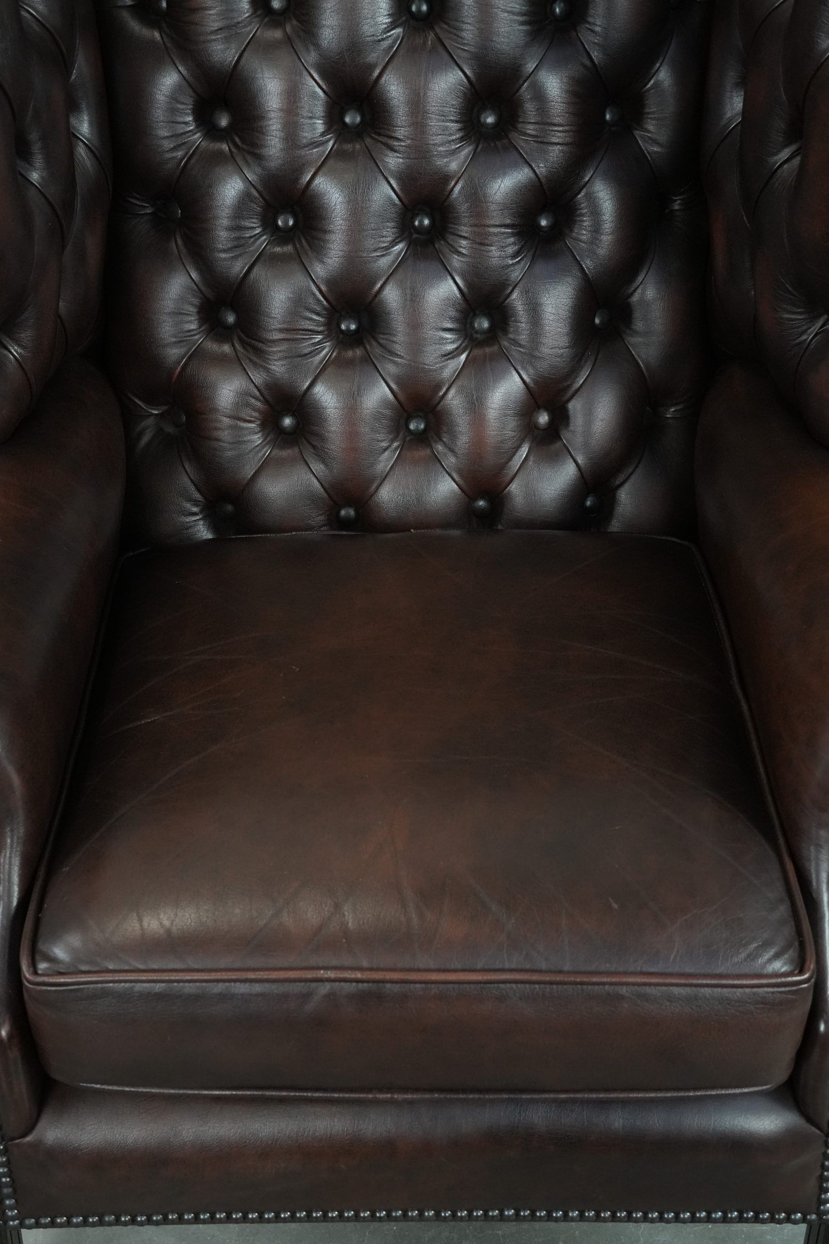 Brown cowhide leather Chesterfield wingback armchair in English style