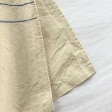 Nappe, écru, surpiqûres bleue/verte