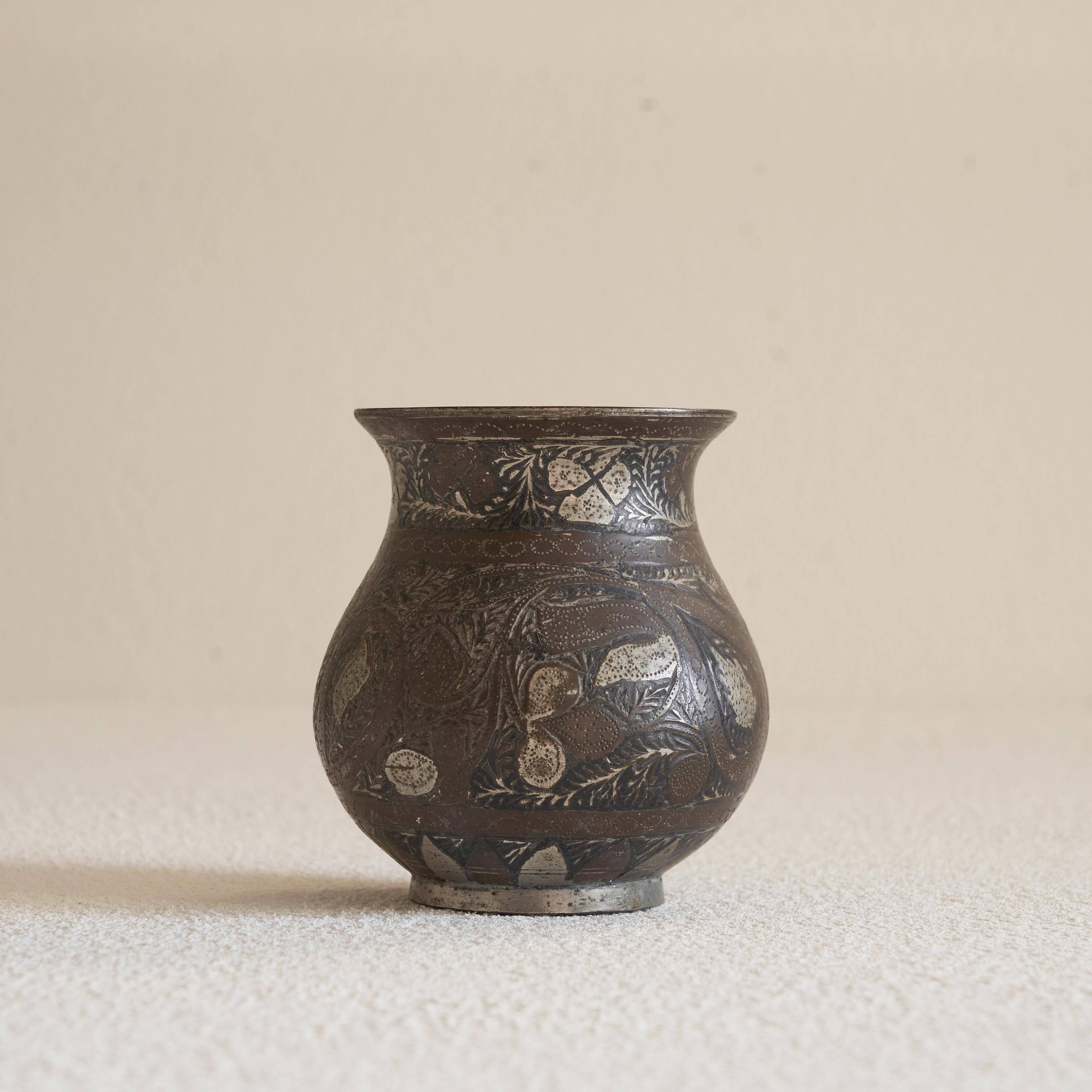 Antique pyriform Bidri vase in the shape of a pyramid.