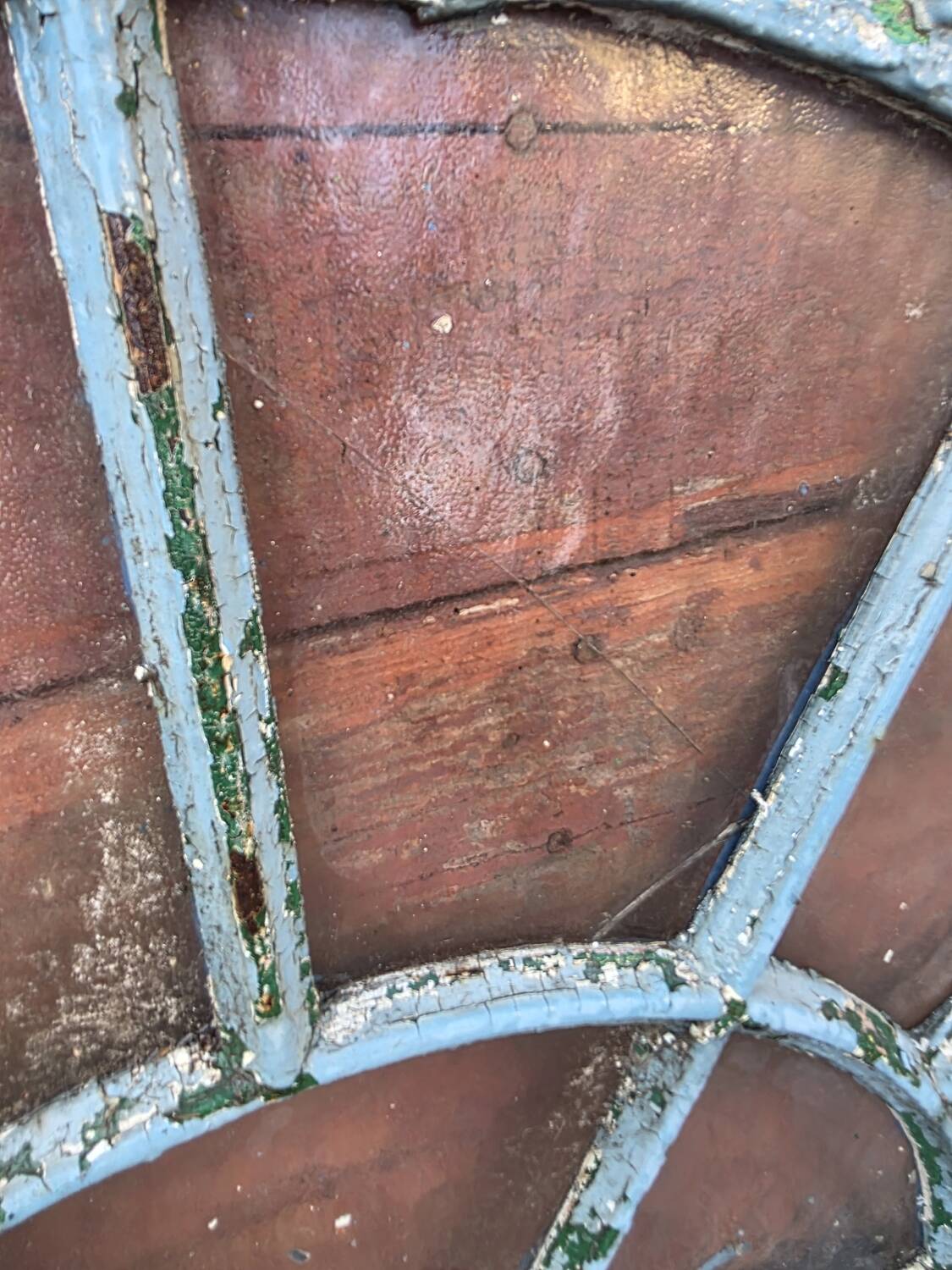 Old wrought iron full riveted gates from the 19th century.