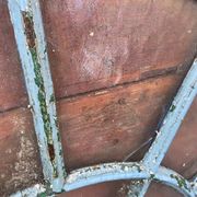 Old wrought iron full riveted gates from the 19th century.
