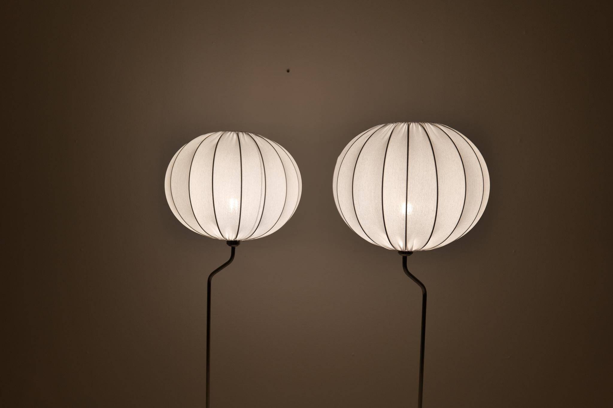 Pair of Bergboms marble and steel floor lamps from the mid-century, 1970s, Sweden.