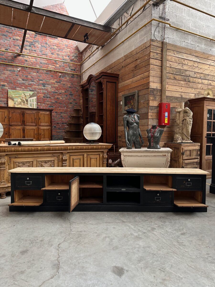 Old workshop furniture transformed into a TV unit.