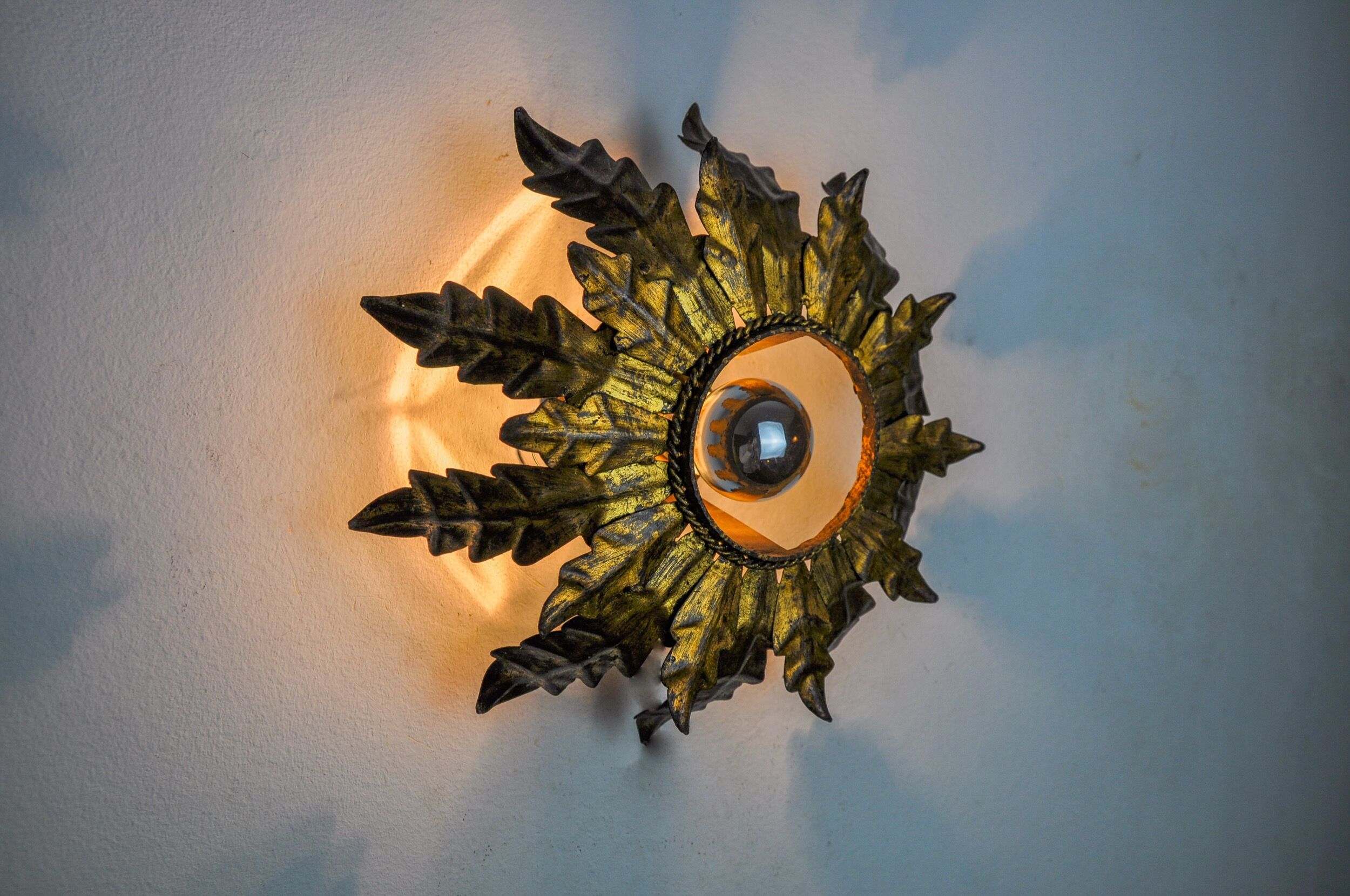 Sun wall lamp by ferro arte, metal and gold leaf, Spain, 1960