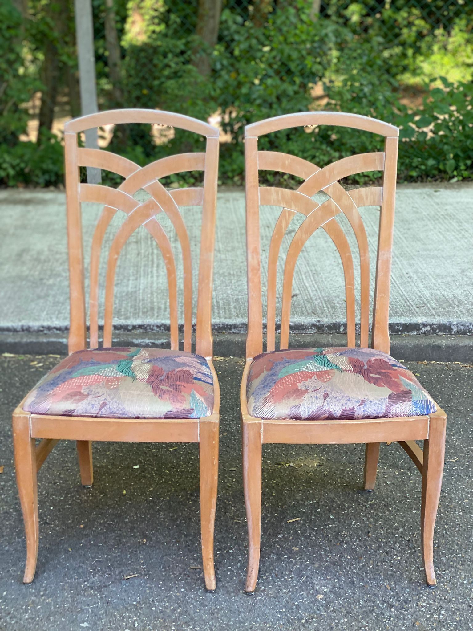 2 dining or kitchen chairs with high backs and fabric.