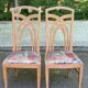 2 dining or kitchen chairs with high backs and fabric.