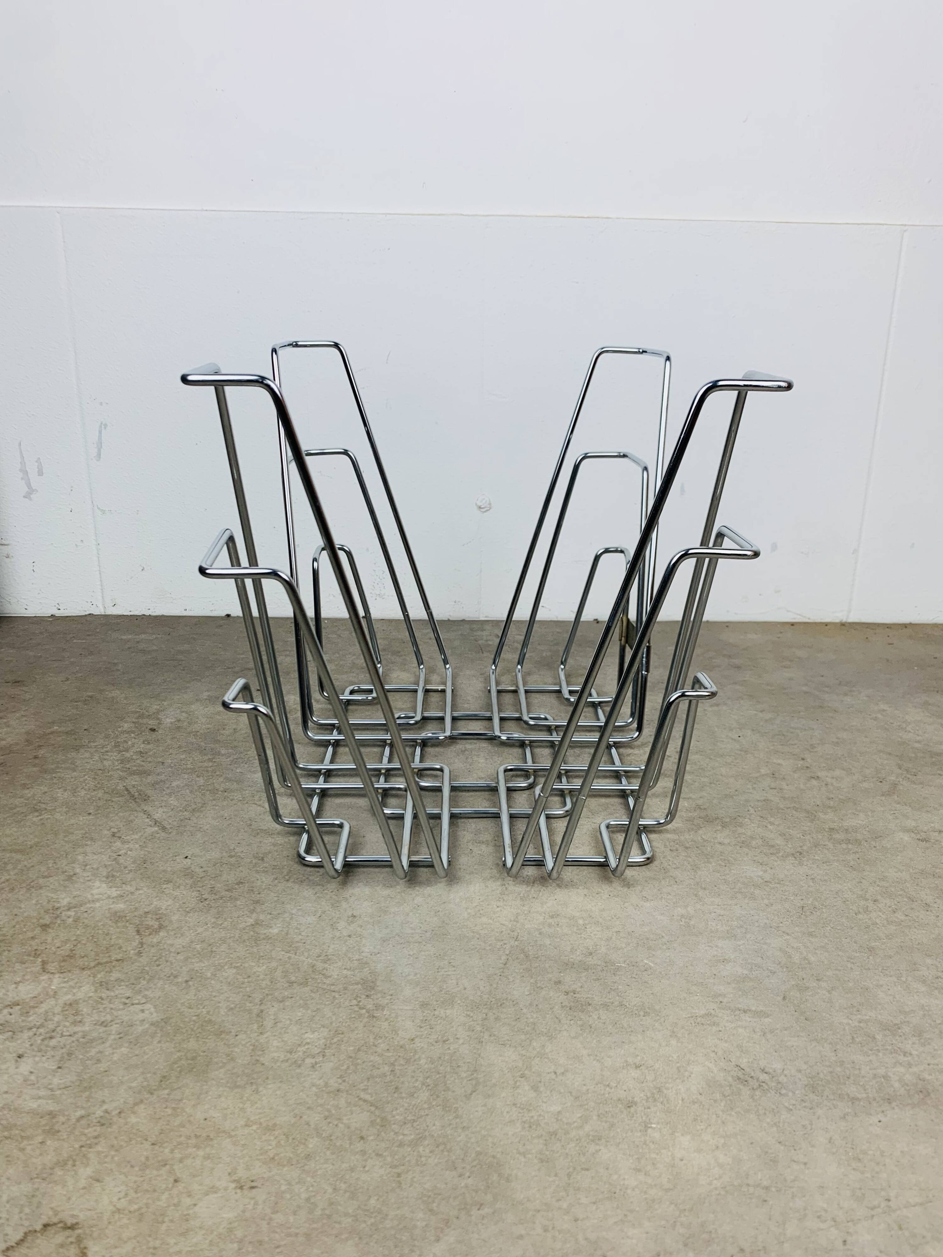 Chrome metal magazine rack or vinyl holder from the 70s.