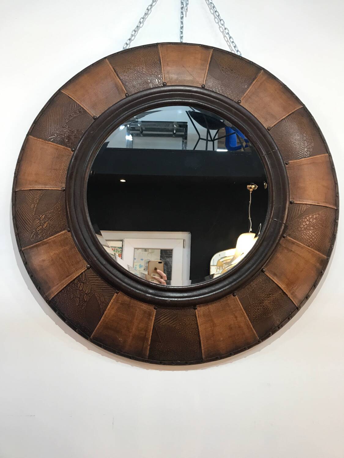 Large round leather mirror