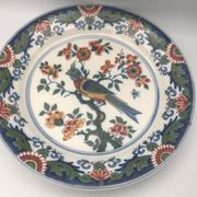 Assiette murale en faïence à décor de peinture de fleurs et oiseau 28 cm