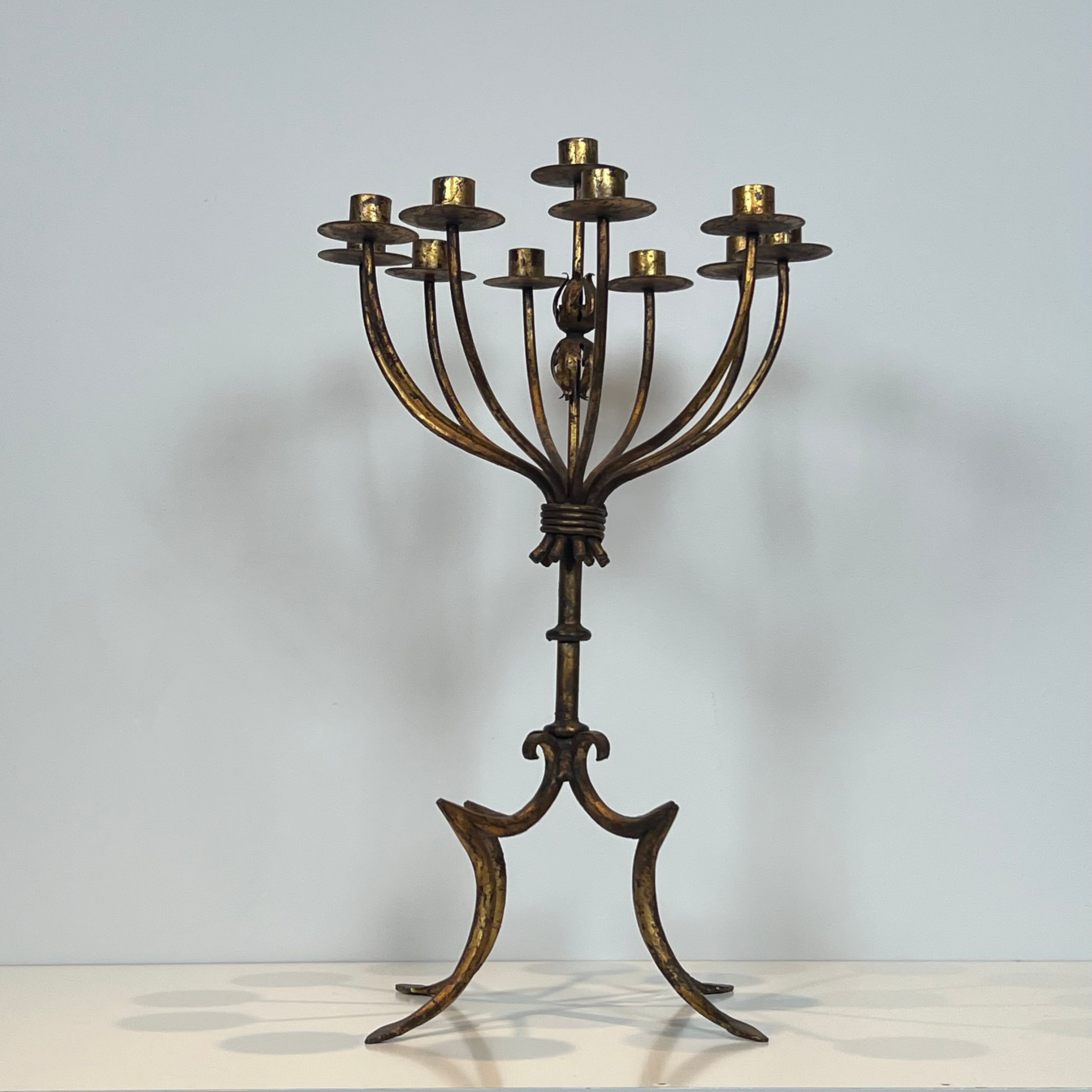 Important gilded wrought iron candelabrum with 11 arms.