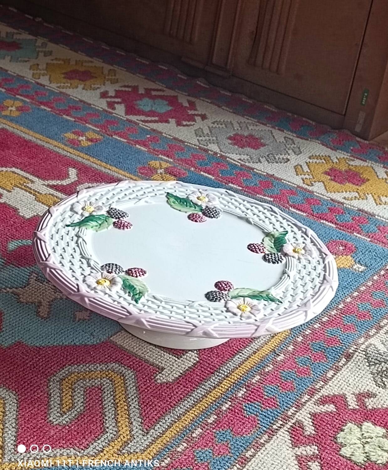 Footed dessert plate in barbotine porcelain, marked FG.