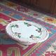 Footed dessert plate in barbotine porcelain, marked FG.