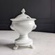 White porcelain confiturier with lion paws and masks. 19th century.