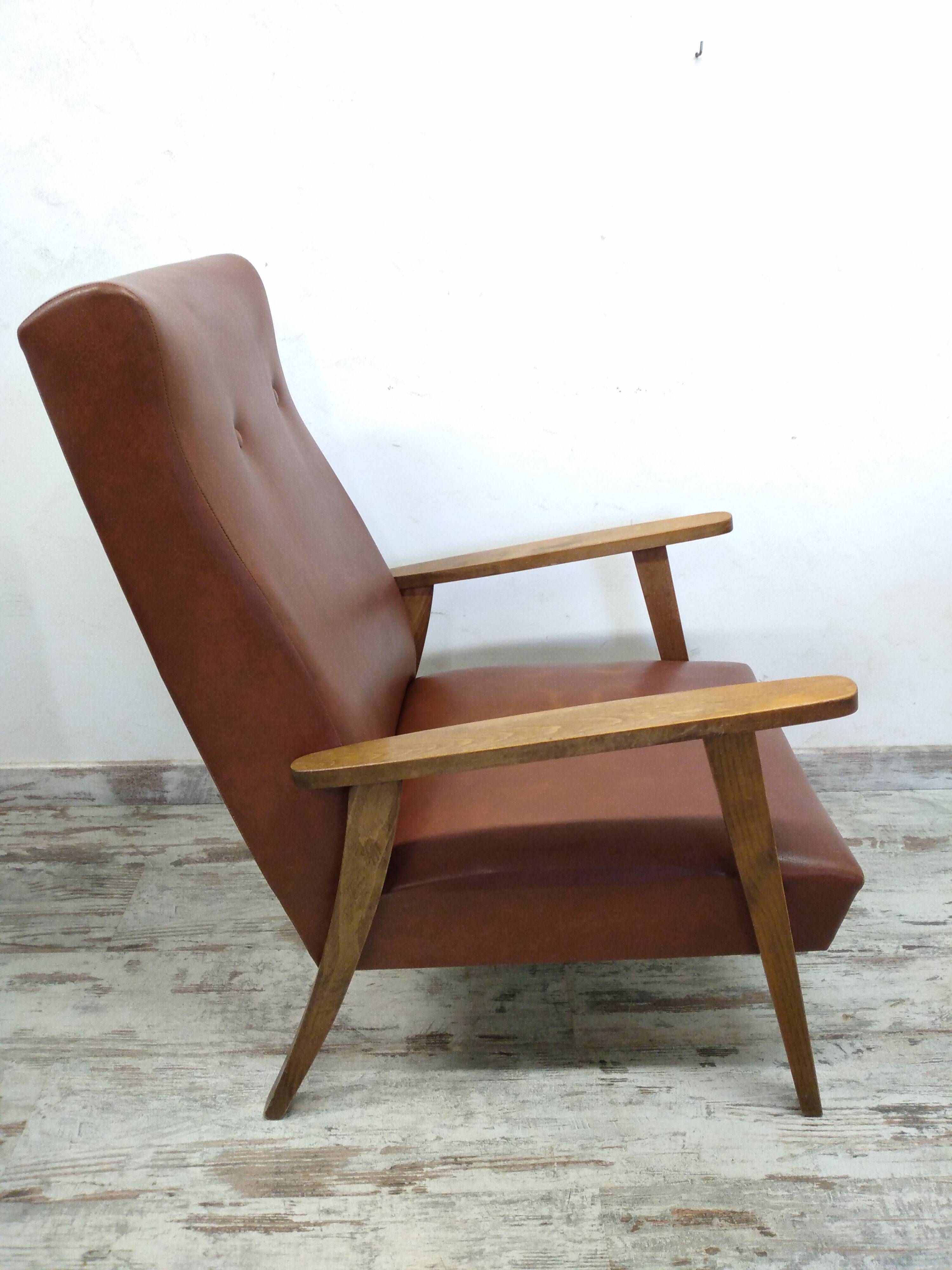 Vintage armchair in wood and imitation leather