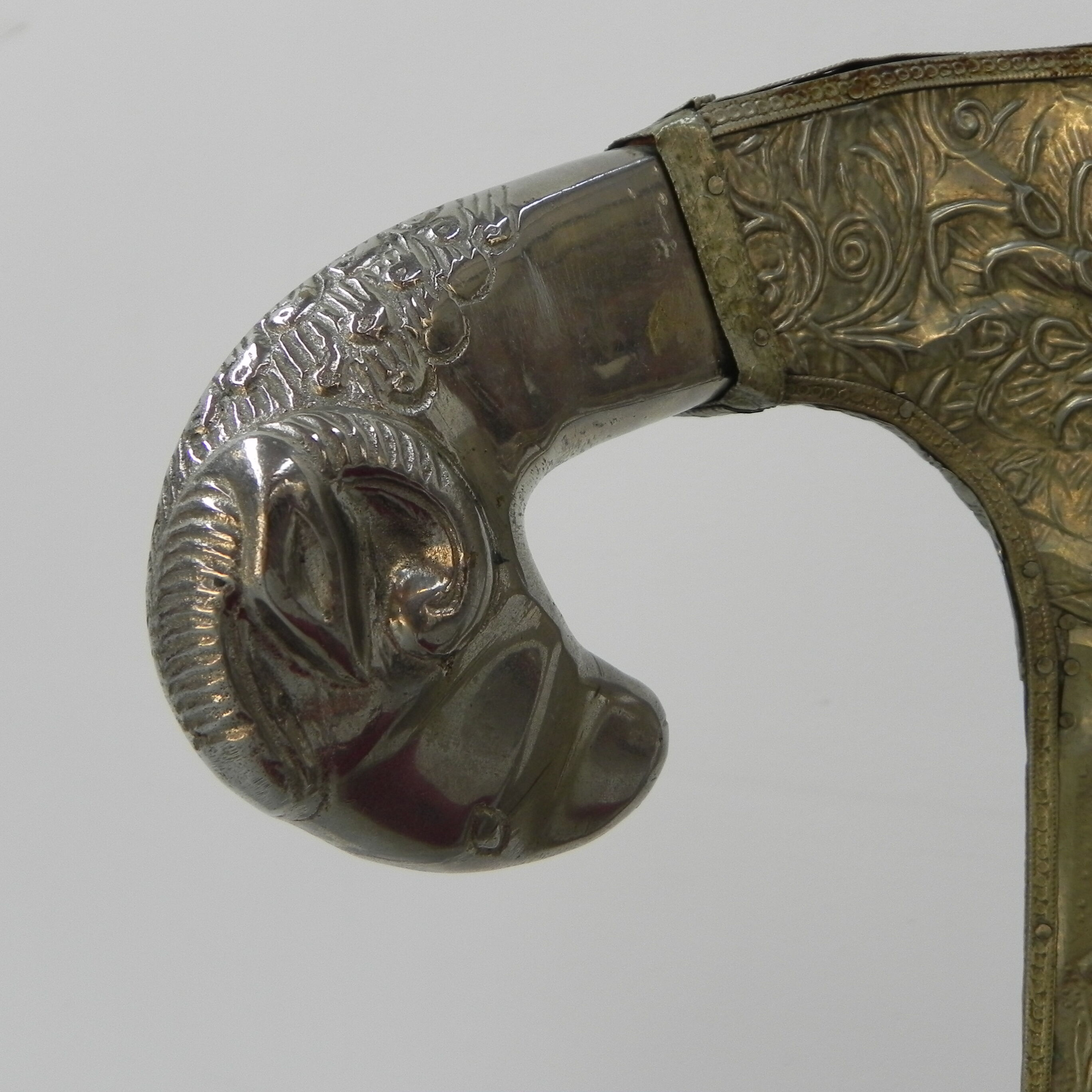 Dining chair upholstered with stamped tin